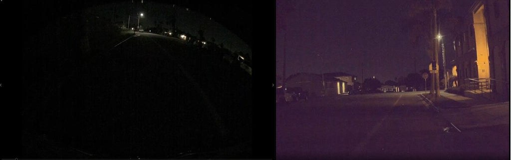 Backup camera screen at night showing blurry driveway view with headlights and auto-exposure glare