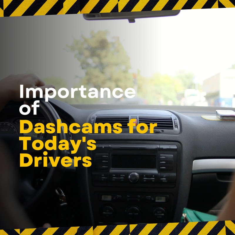 Dash cam mounted behind a car's rearview mirror with power cord visible along the windshield edge