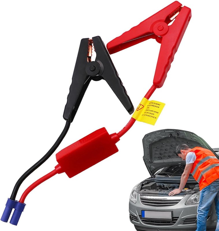 A person's hands inspecting the case, clamps, and cables of a portable jump starter for damage.